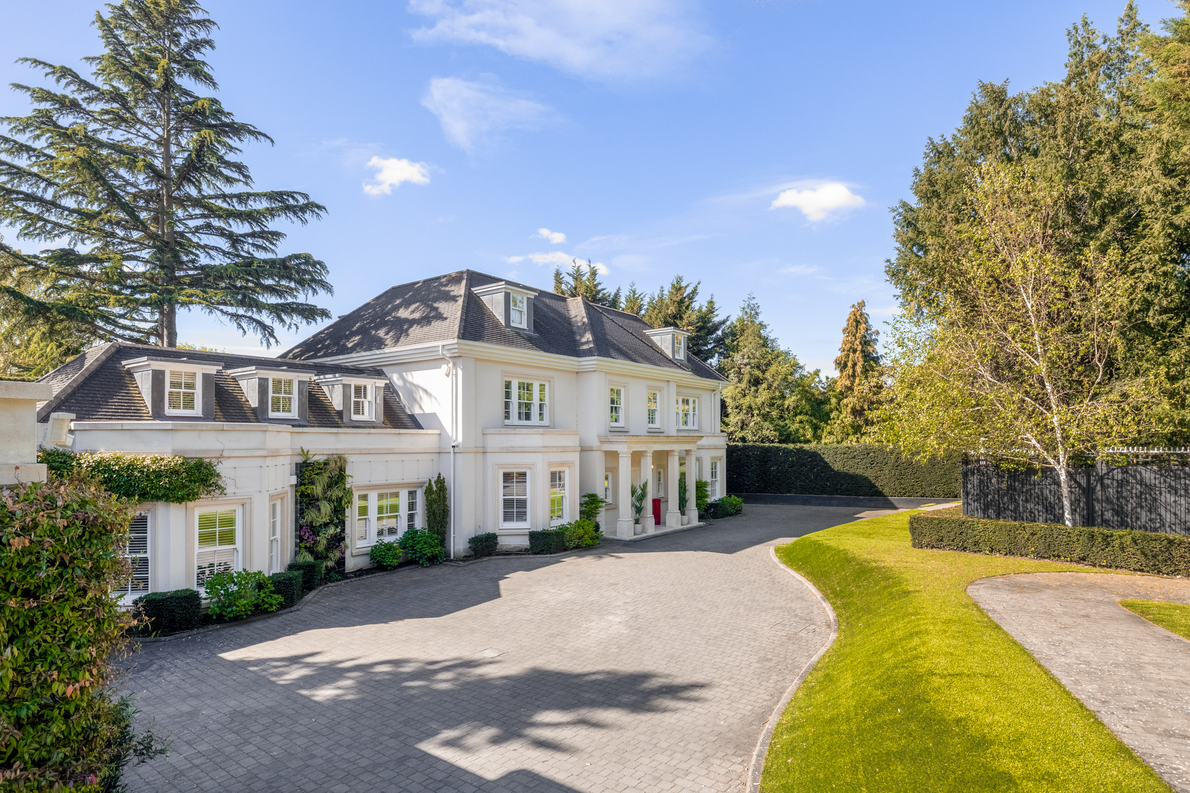 A secluded detached house at the end of a private driveway on Coombe Lane West