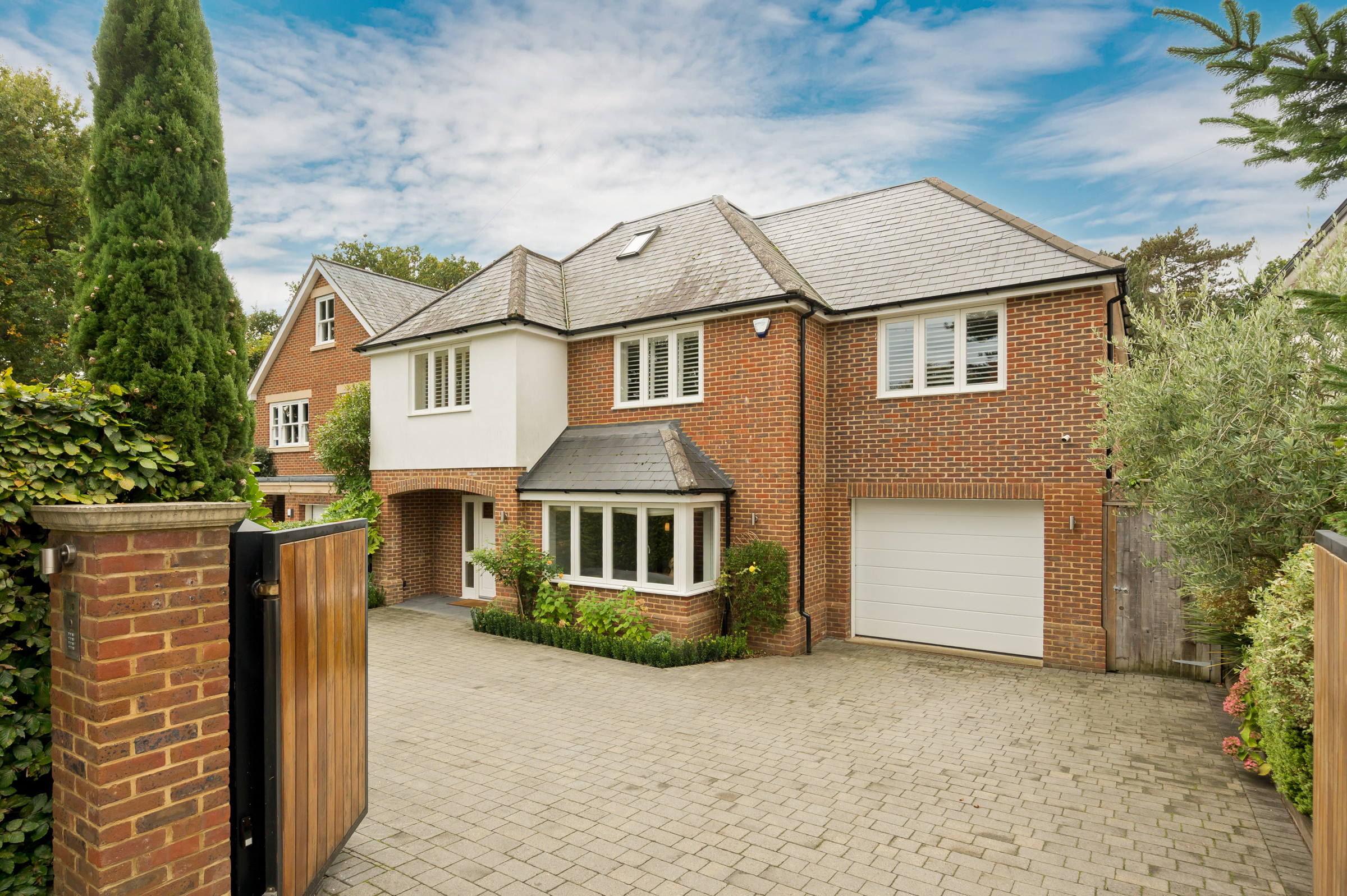 A substantial detached family house with a landscaped garden in Cobham
