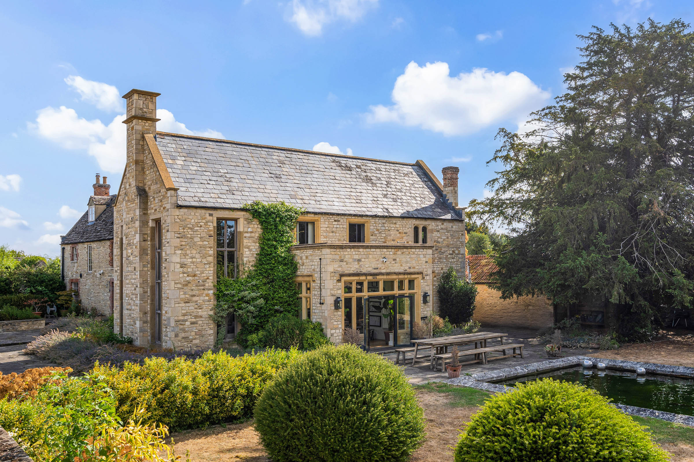 A Grade II-Listed Cotswolds House with Two Acres of Walled Gardens