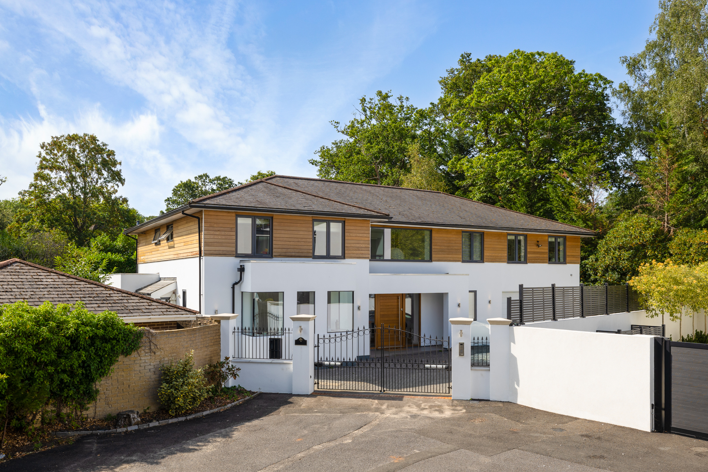 A detached modern six bedroom family house located on the private Coombe Estate
