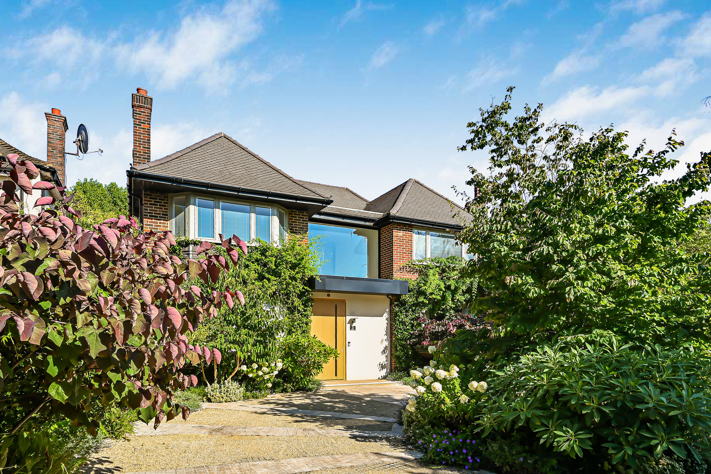A comprehensively remodelled family house on a private road in Coombe