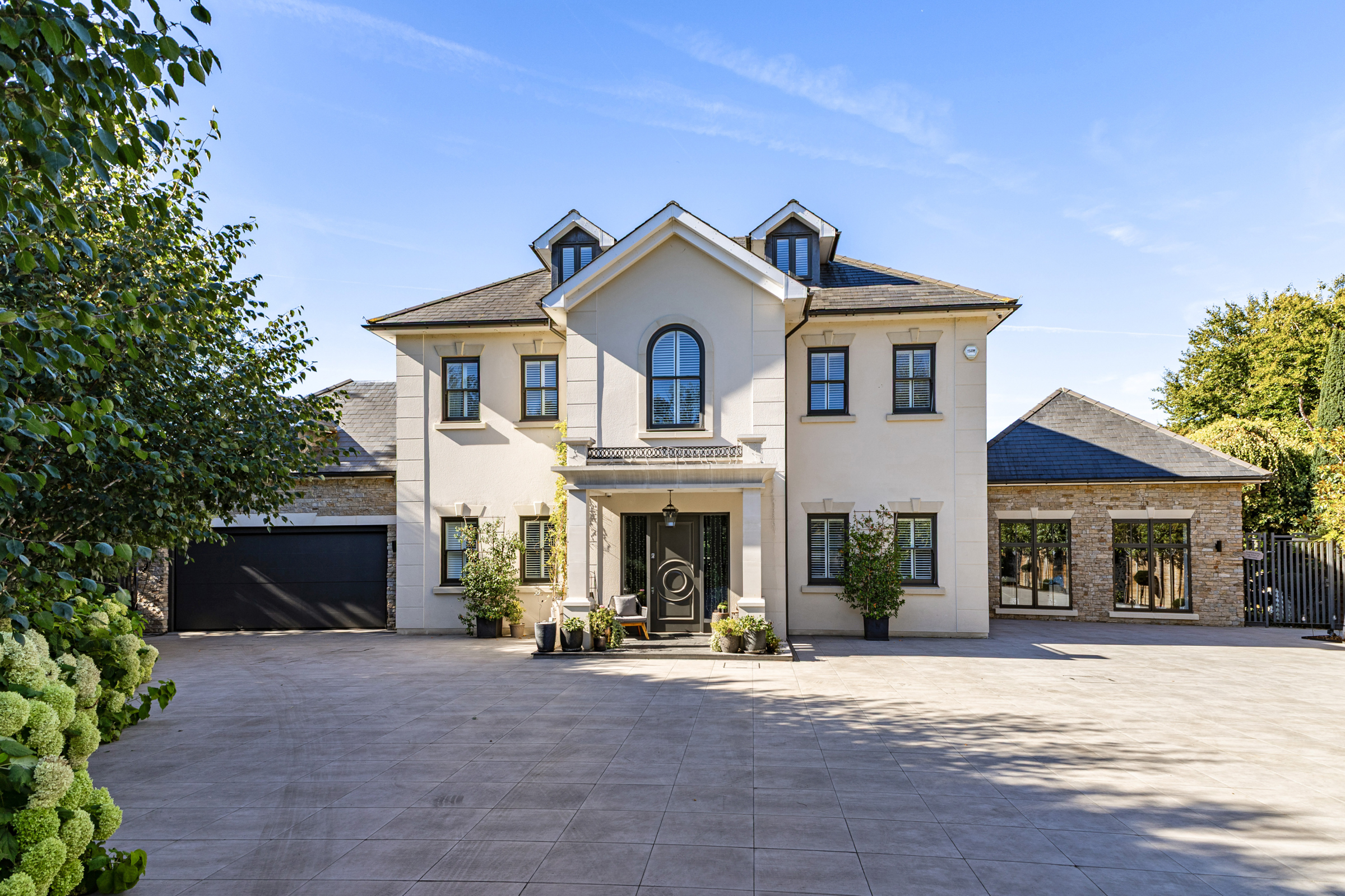 A seven-bedroom Cobham home with a swimming pool and landscaped gardens